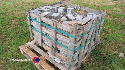 Crate of cubed grey granite cobbles