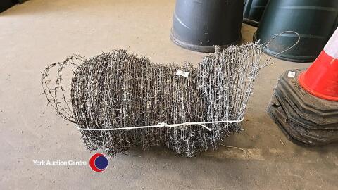 Around 30m lengths of barbed wire coils