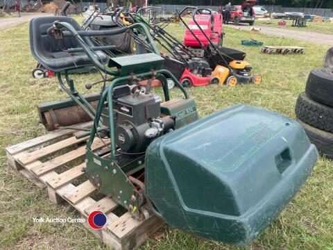 Atco lawnmower with seat and roller