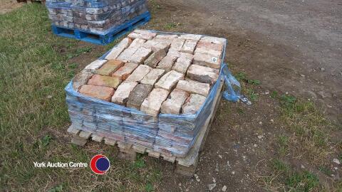 Pallet of mixed sized hand clamped bricks