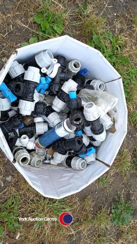 Box of plastic water pipe fittings