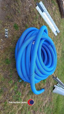 Roll of blue drainage pipe