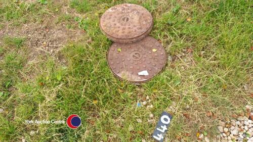 2 round cast iron manholes approx 500mm diameter