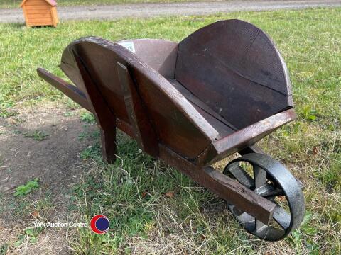 Wooden wheel barrow as planter