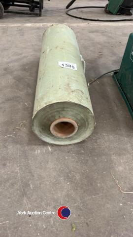 Roll of green plastic bale wrap