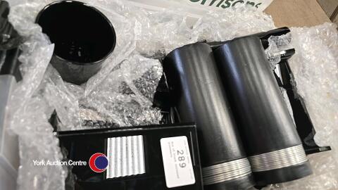 Box of black coloured glassware