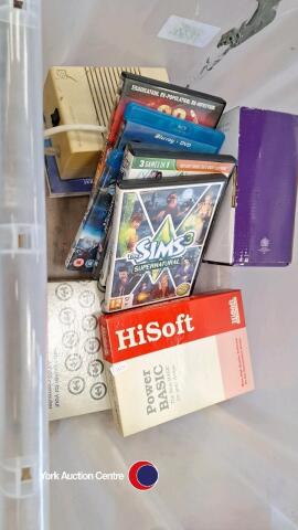 Box of old computer items, video games and DVDs
