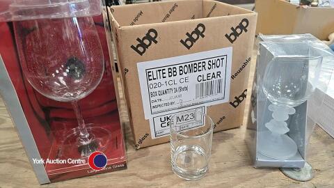 Full bottle wine glass plus other glasses