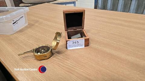 Heavy brass compass with navigational aids, stamped Stanley London