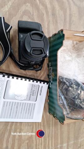 Olympus digital camera E-500 plus 40-150mm AF zuiko lens. Manual, battery, charger and accessories.