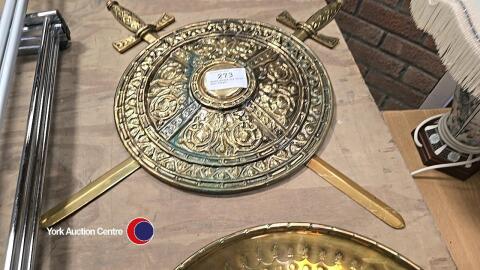 Brass shield and sword wall hanger