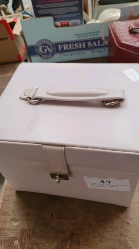 Pale grey carrying case full of costume jewellery