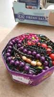 Tin of bead jewellery