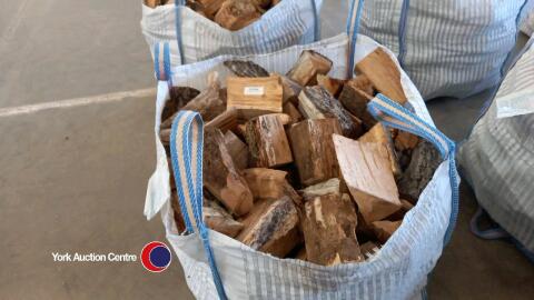 Oak logs in vented bulk bag, ready to burn