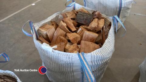 Oak logs in vented bulk bag, ready to burn