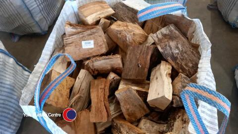 Oak logs in vented bulk bag, ready to burn
