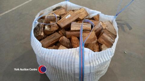 Oak logs in vented bulk bag, ready to burn