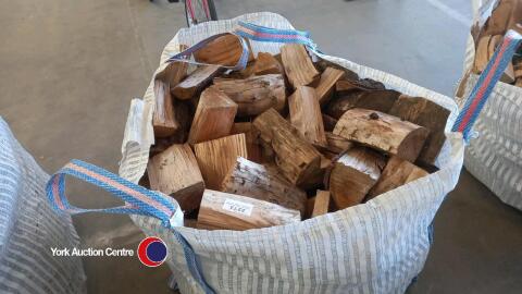 Softwood logs in vented bulk bag, ready to burn
