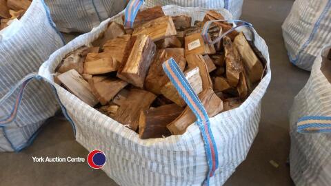 Oak logs in vented bulk bag, ready to burn