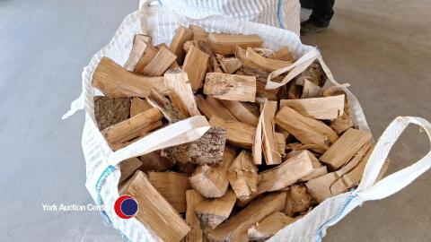 Barn dried hardwood logs in vented bulk bag