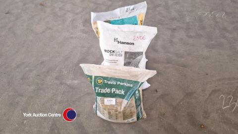 Bag of builder's sand, bag of rock salt and bag of decorative stone